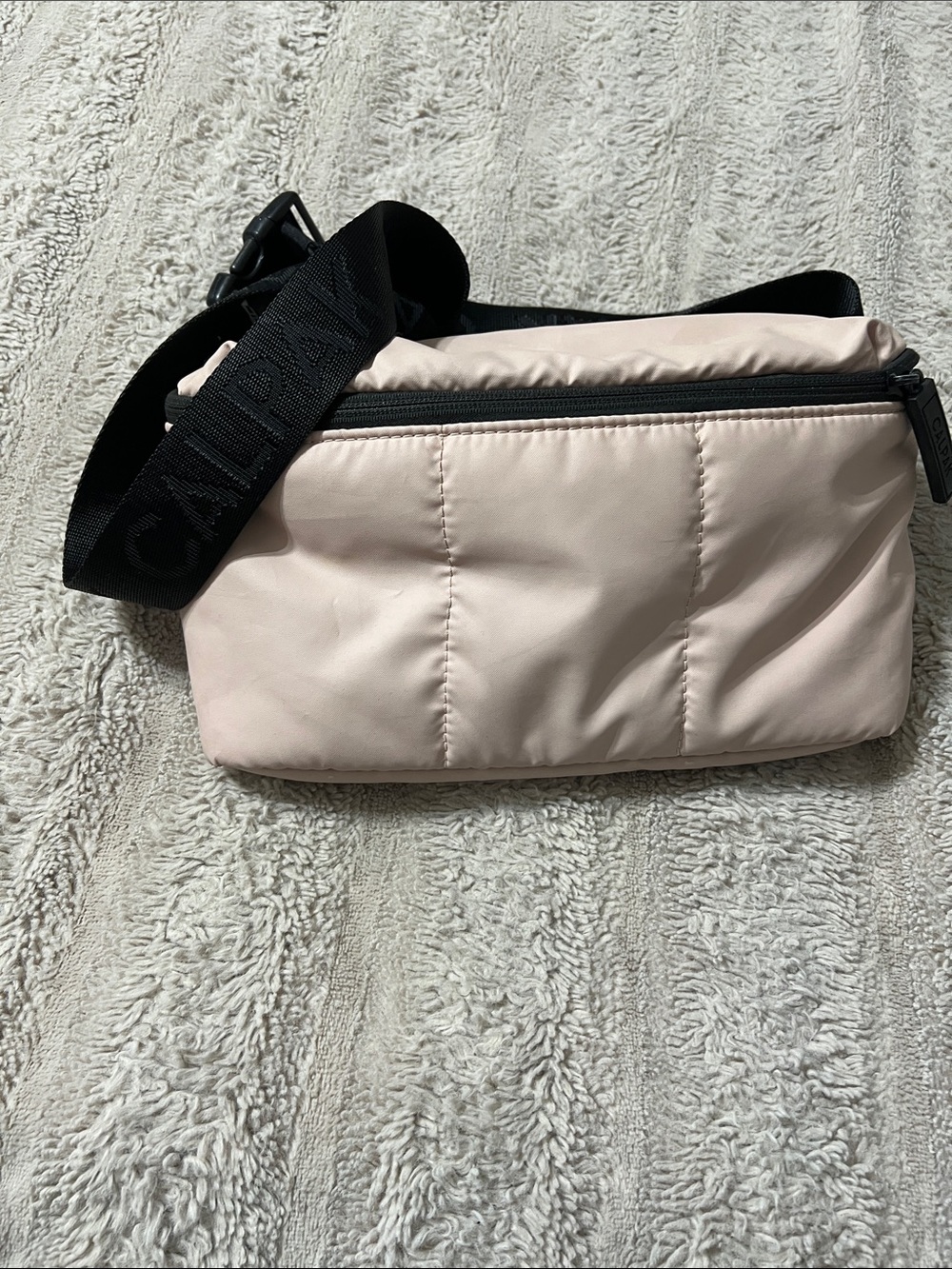 Calpak pale pink quilted crossbody with black branded strap